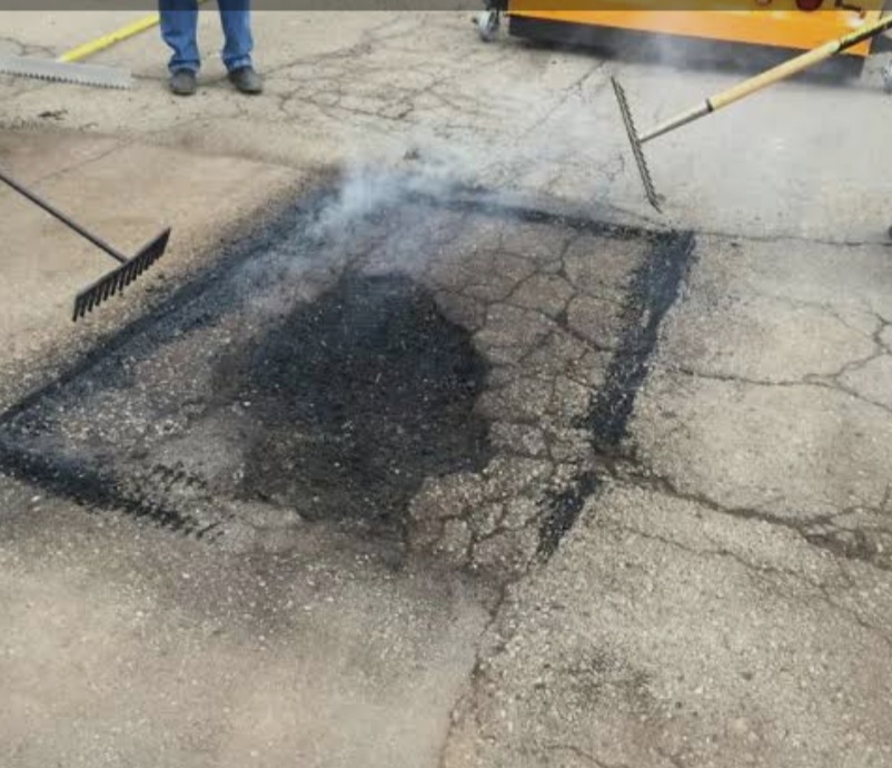 Damaged asphalt before