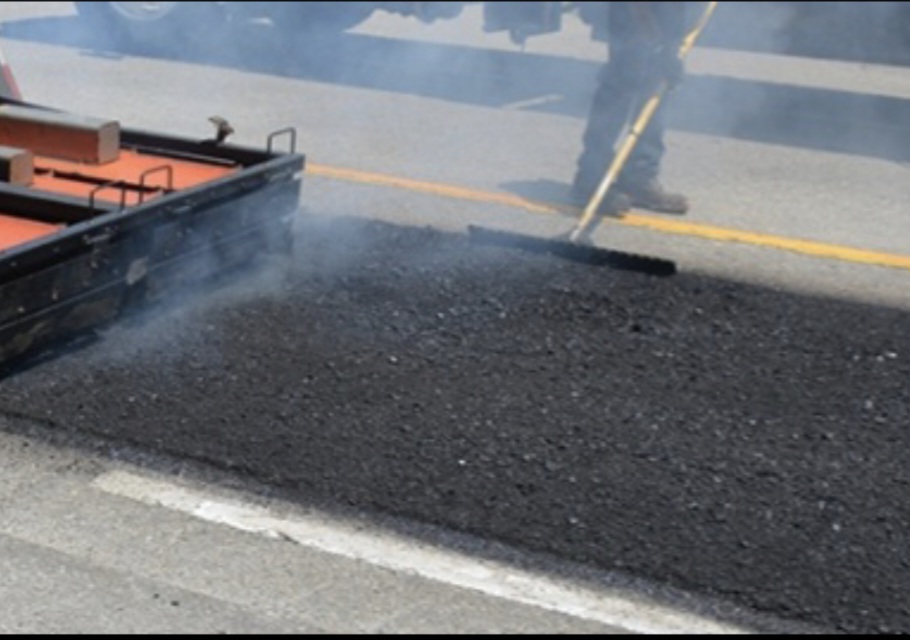 Thermal infrared asphalt repair — steam rising